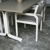 Dining table set and 4 dining chairs by Pierre Mennen for Pastoe.