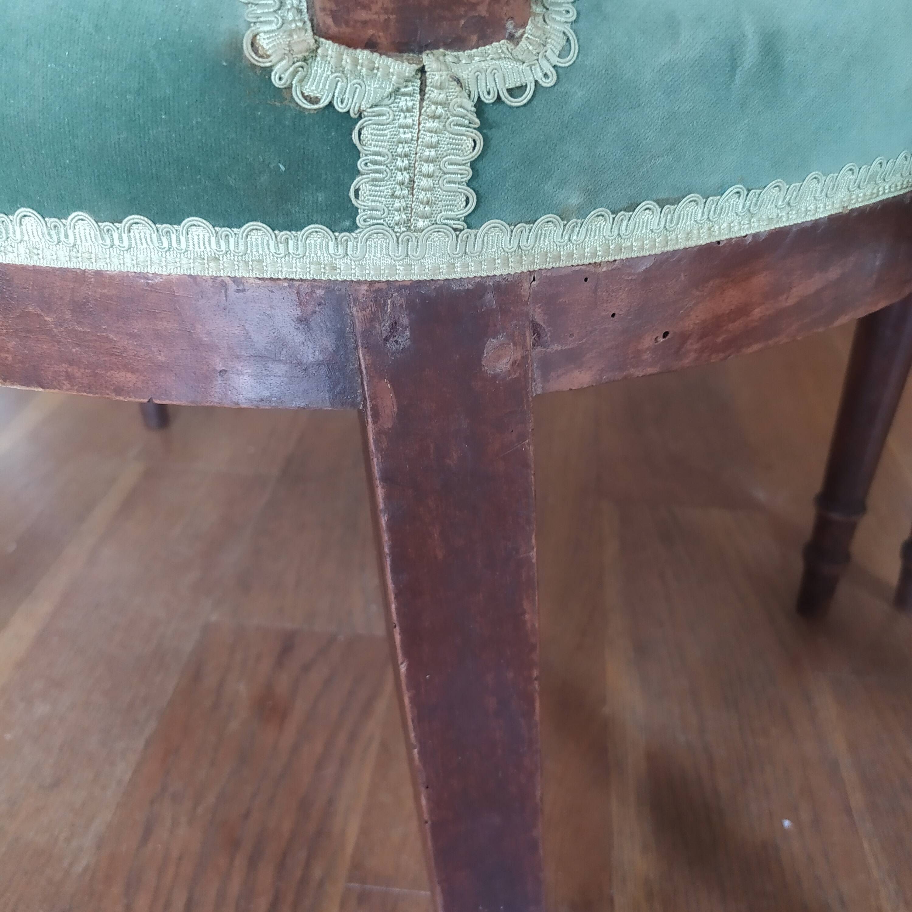 pair of Directoire armchairs in walnut, early 19th century, green velvet