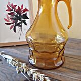 Amber glass pitcher decorated