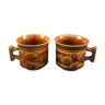Two brown coffee cups
