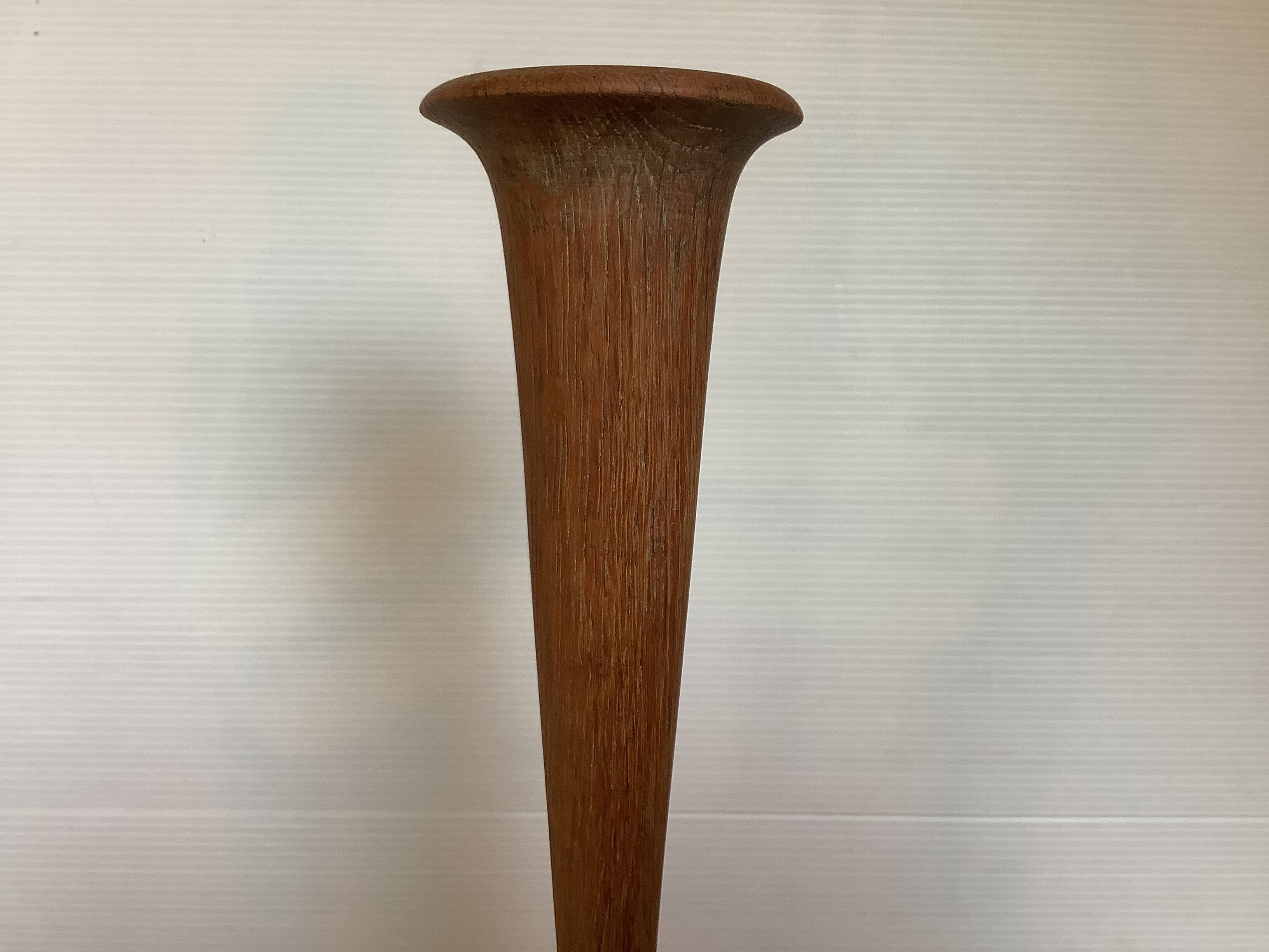Old trumpet-shaped wooden vase