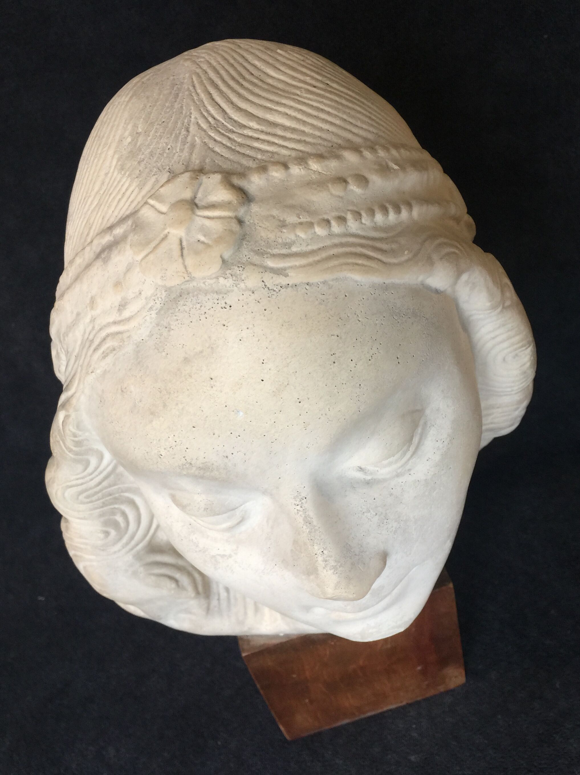 Bronze-middle-aged woman's head in plaster