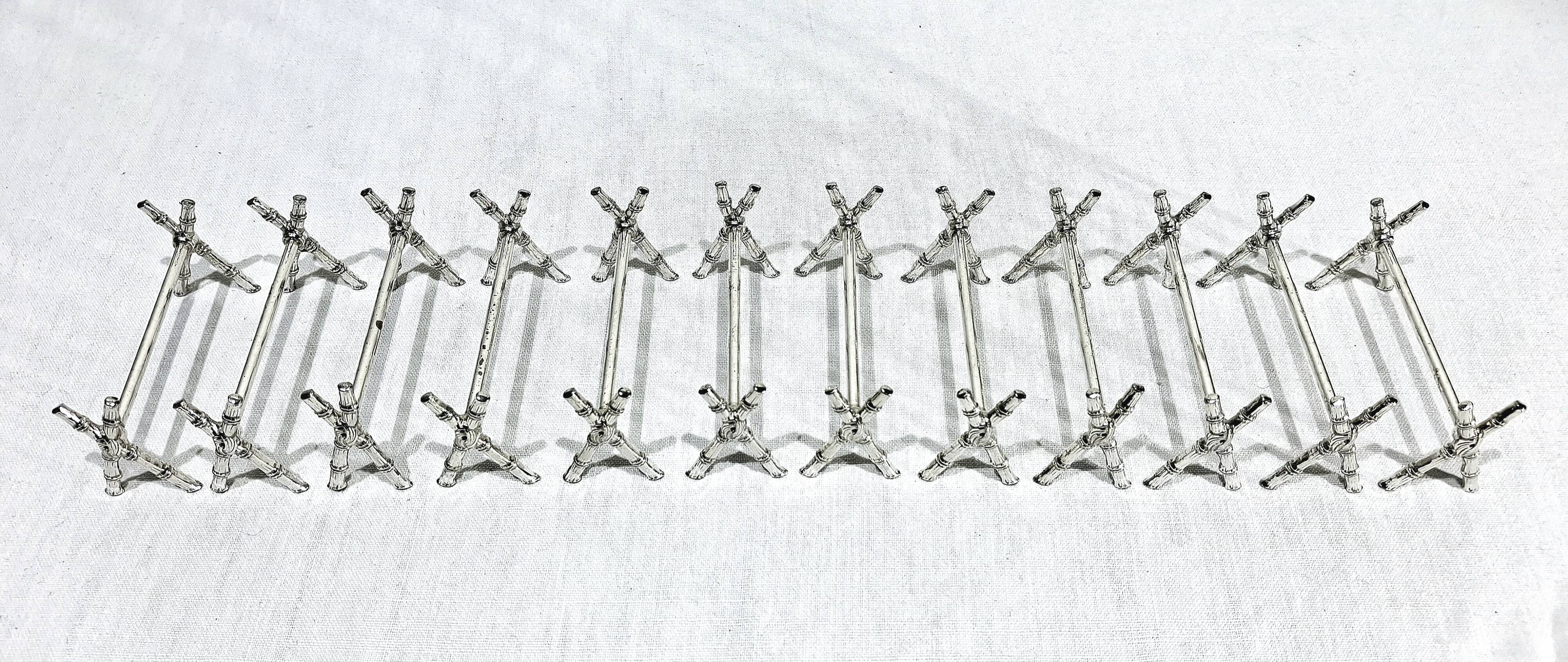 12 silver-plated metal knife handles, in a case.