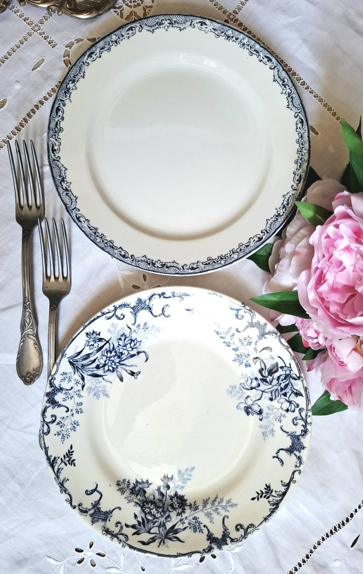 Old mismatched flat plates made of ironstone earthenware.
