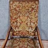 Renaissance armchair in carved walnut with lion head decoration