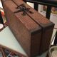 Braided straw suitcase
