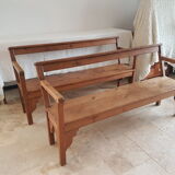 Church bench in fir tree with armrests