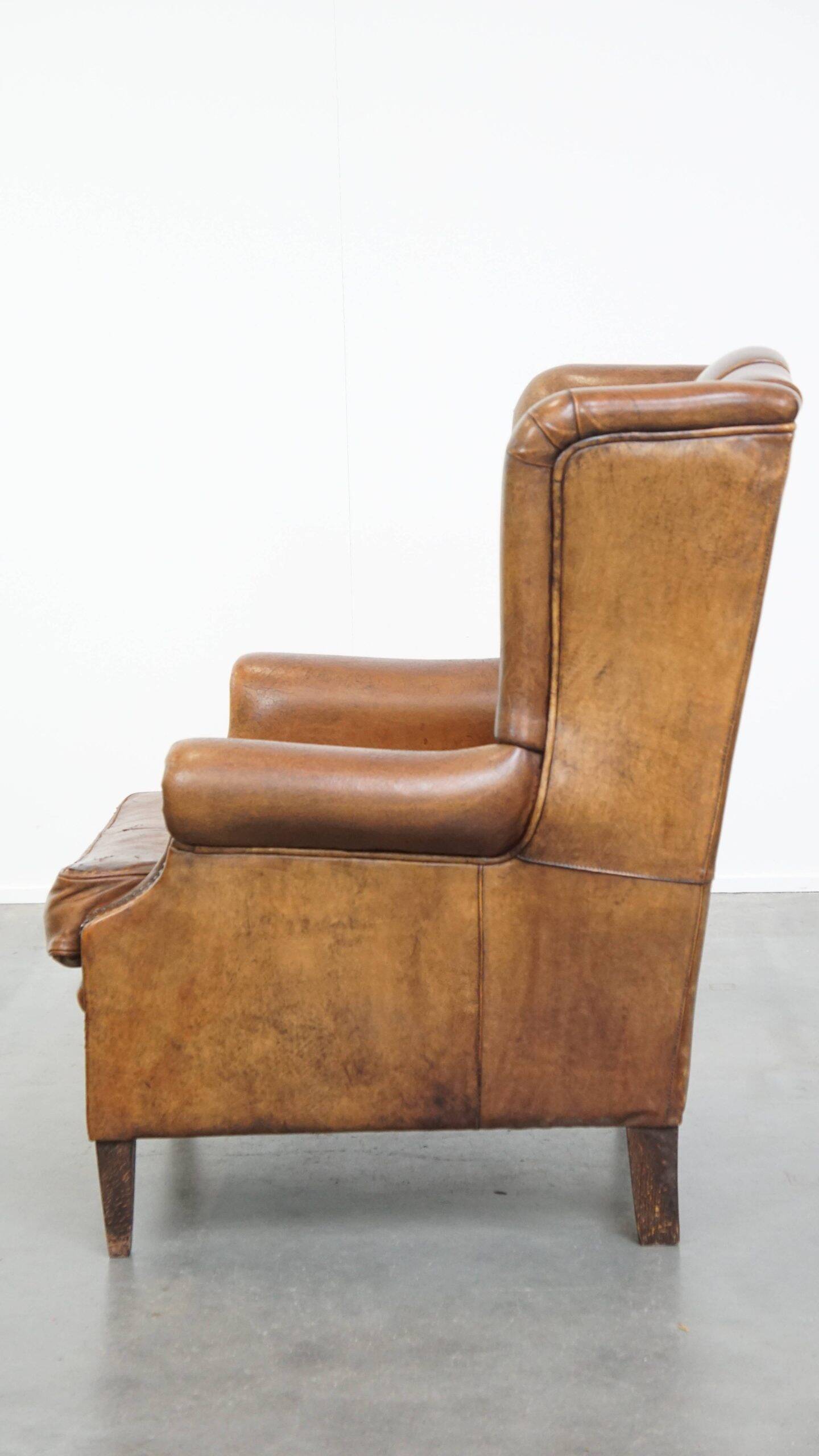 Sheepskin wingback chair in good condition