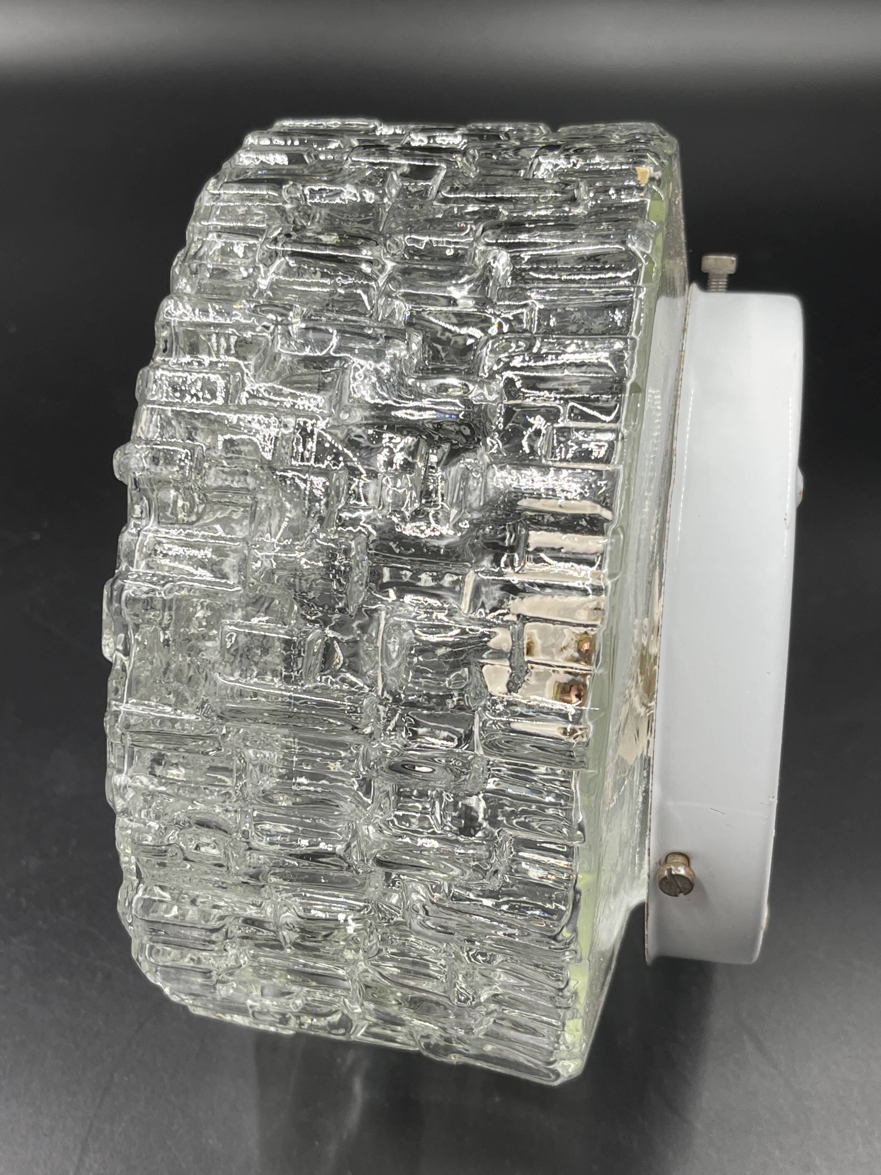 Molded glass ceiling light with relief