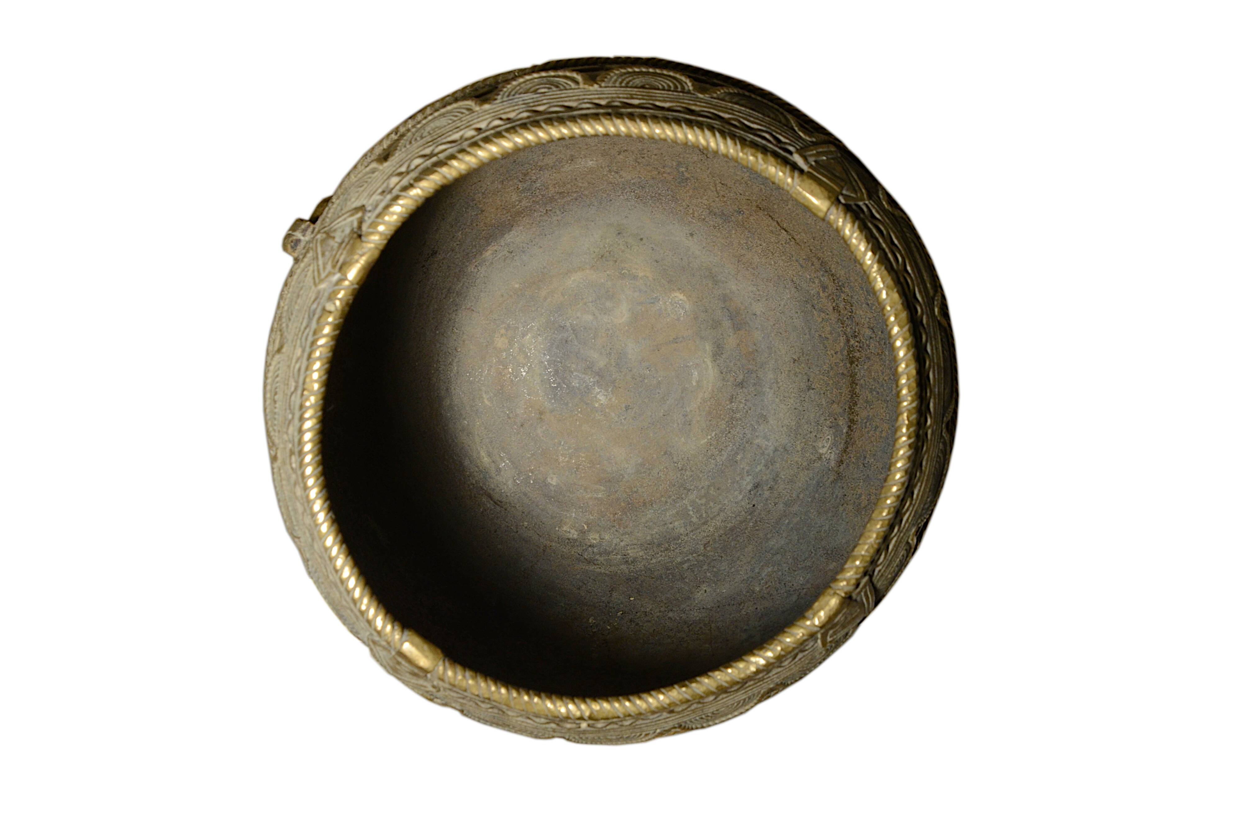 Ancient bronze ethnic pot, handcrafted in India.