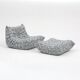 Togo lounge chair and pouf in patterned fabric by Michel Ducaroy for Ligne Roset, 1973, set of 2
