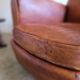 Patinated leather club armchair