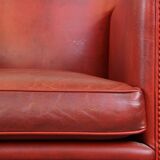 Set of 2 red-colored design armchairs made of sheepskin leather