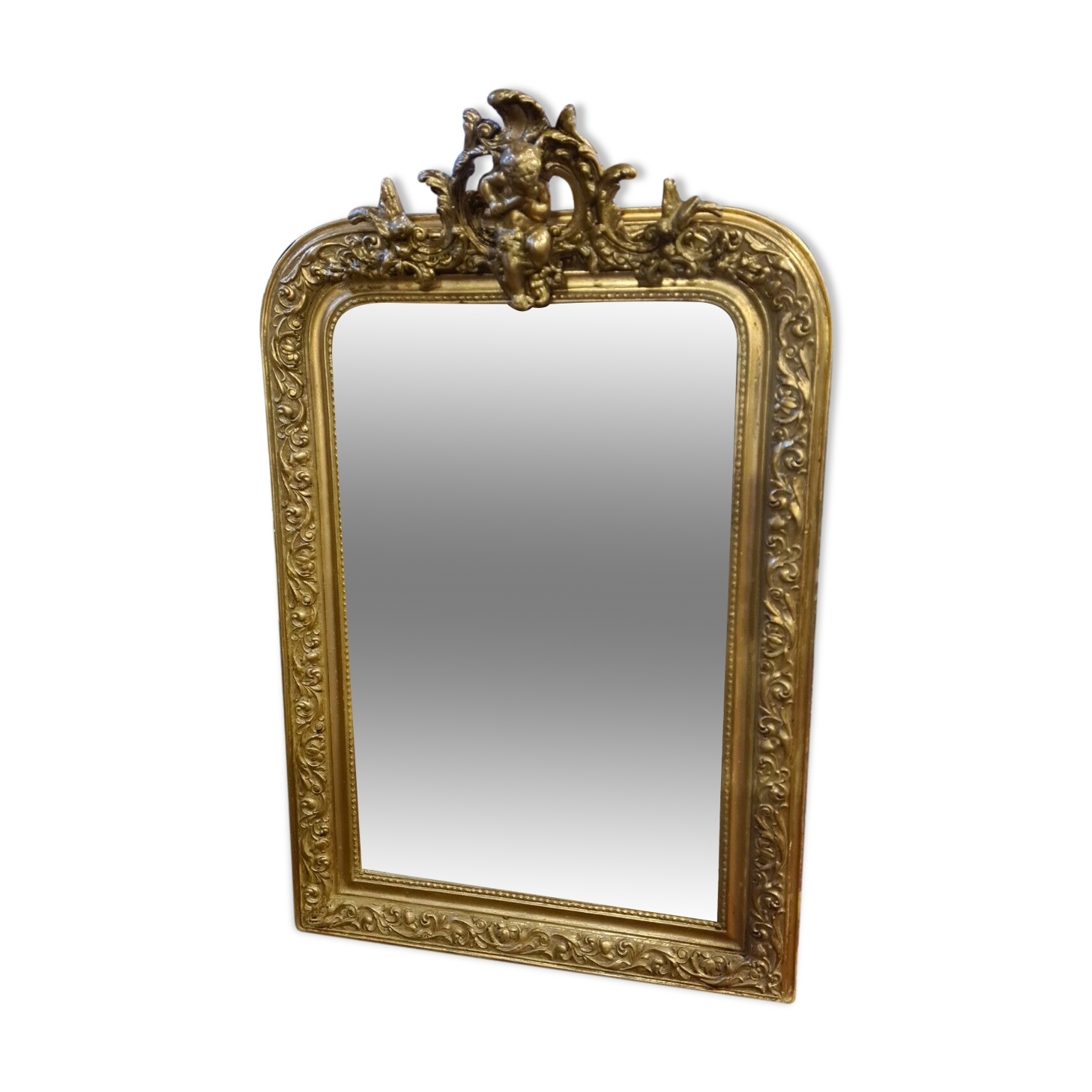 Golden mirror with a flute-playing angel