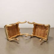 Pair of antique baroque-style poufs in gilded wood, 19th century.