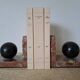 Pair of red marble bookends with black stone spheres – Art Style