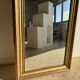 Gilded mirror with frieze h2m10 l:73cm