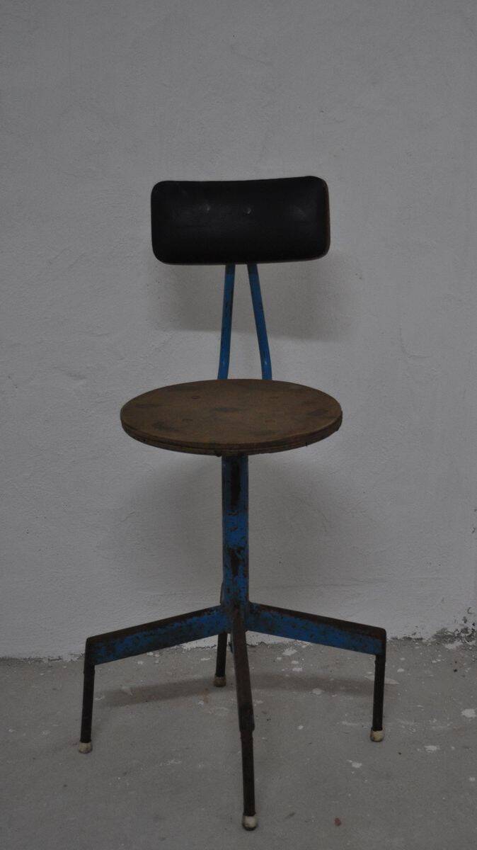 Mid-century industrial chair in metal, leather, and multicoloured wood from the 1960s.