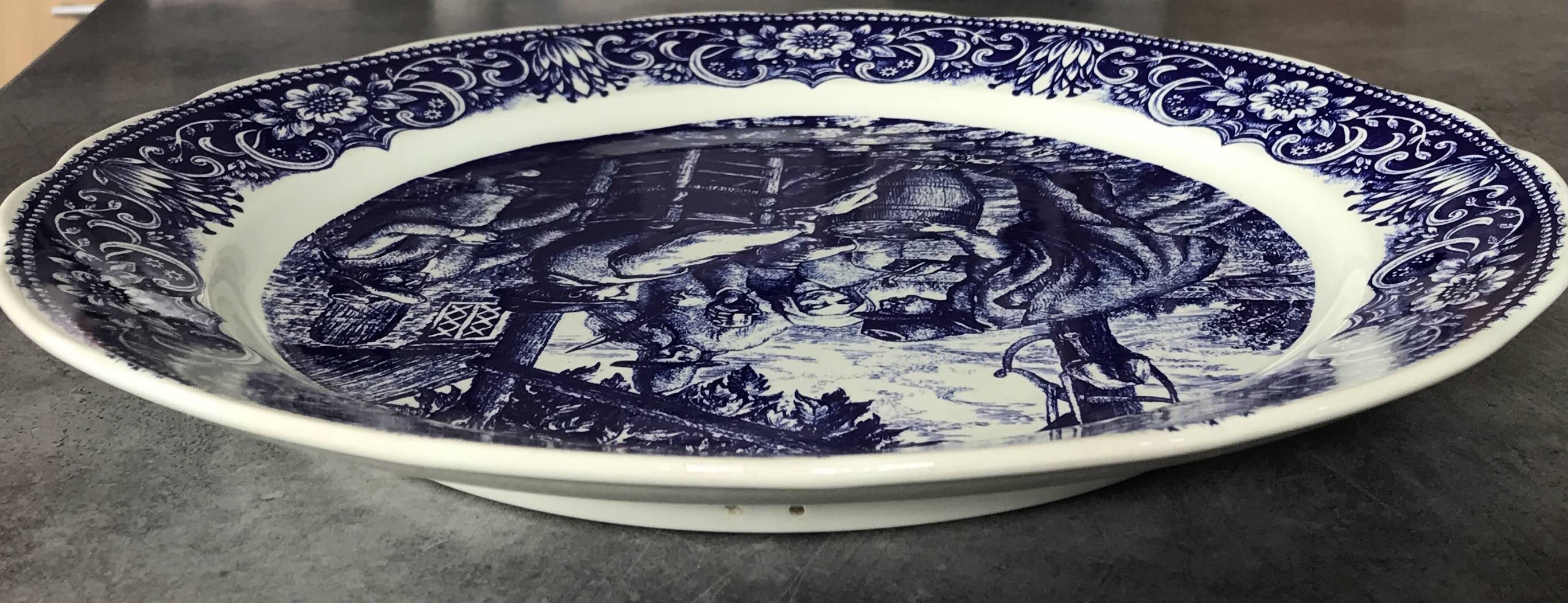 Blue enamelled earthenware wall dish with peasant scene decor Boch La Louvière