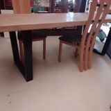 Modern table with metal legs and a natural varnished solid oak top