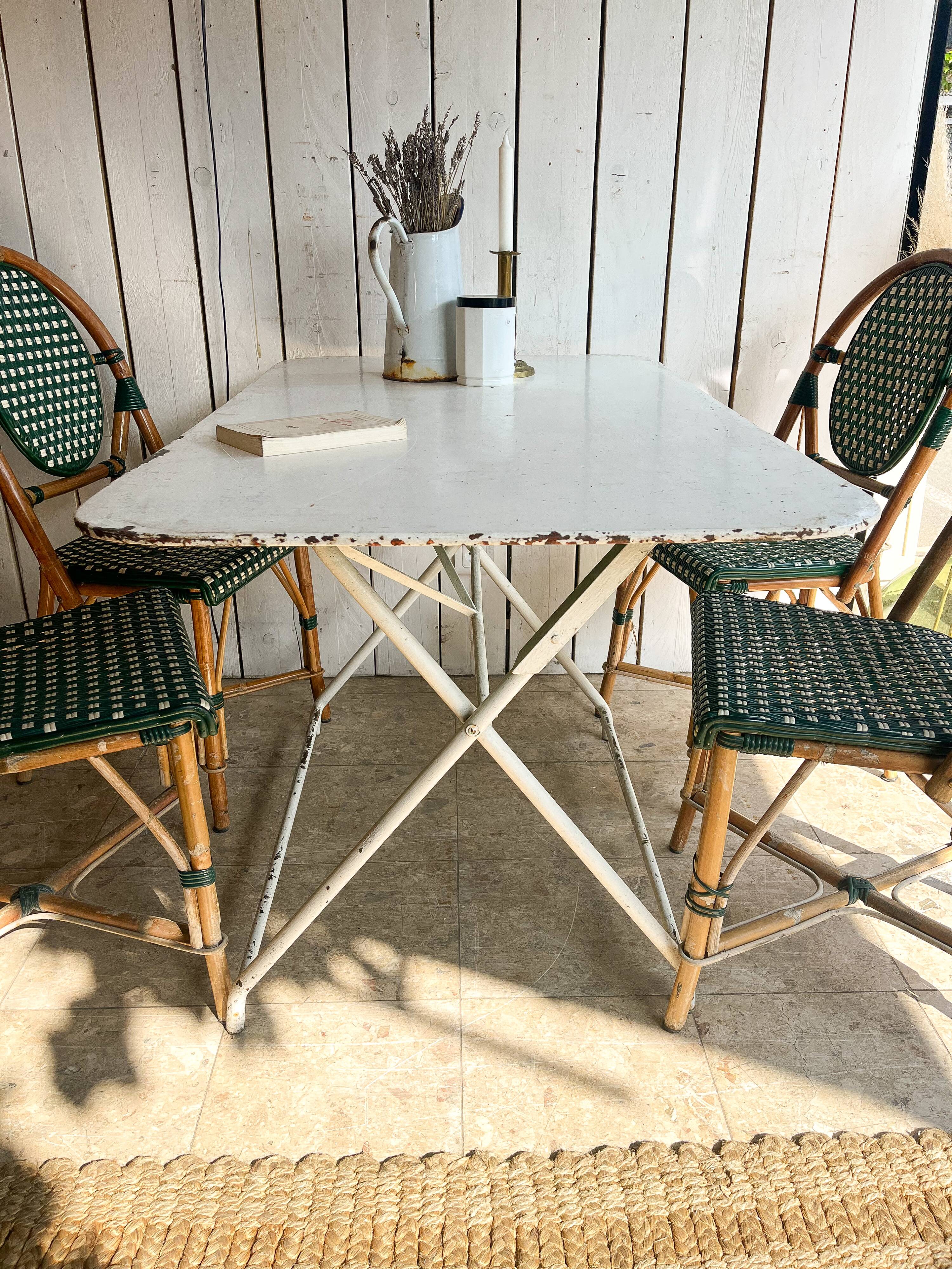 White folding metal bistro table