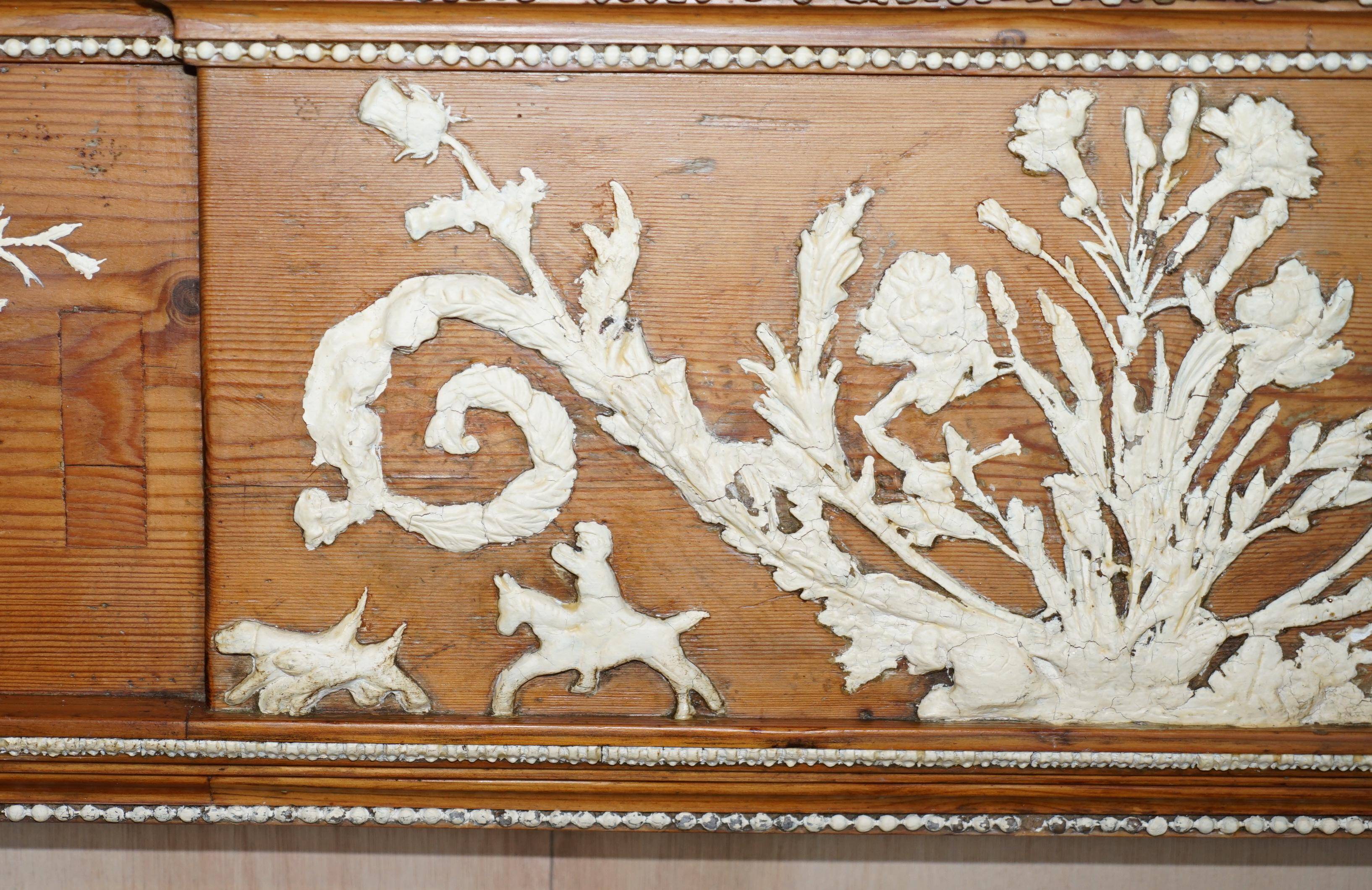 Victorian antique fireplace in tarred pine and sculpted gesso.