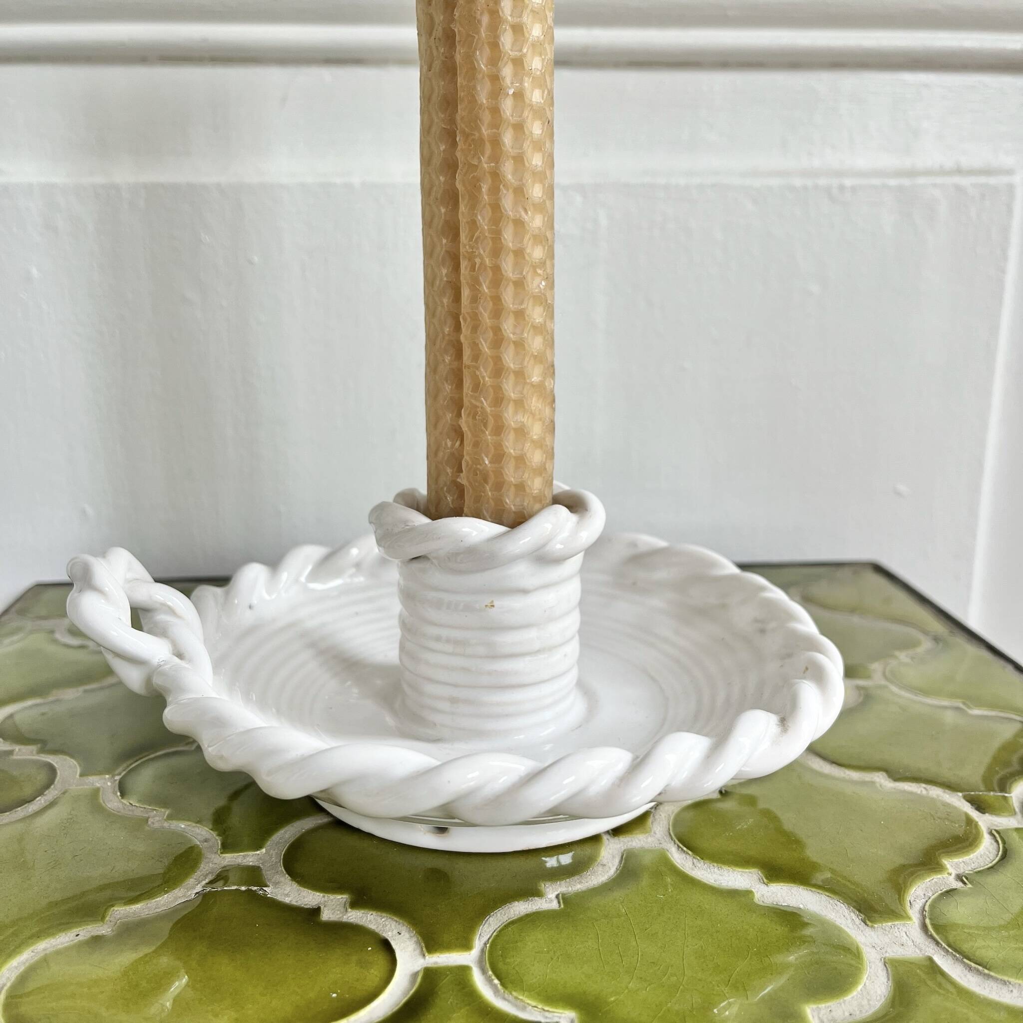 Hand-held candle holder with braided ceramic bowl