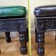 Pair of Moroccan poufs in stamped leather with a carved wooden base, Rabat