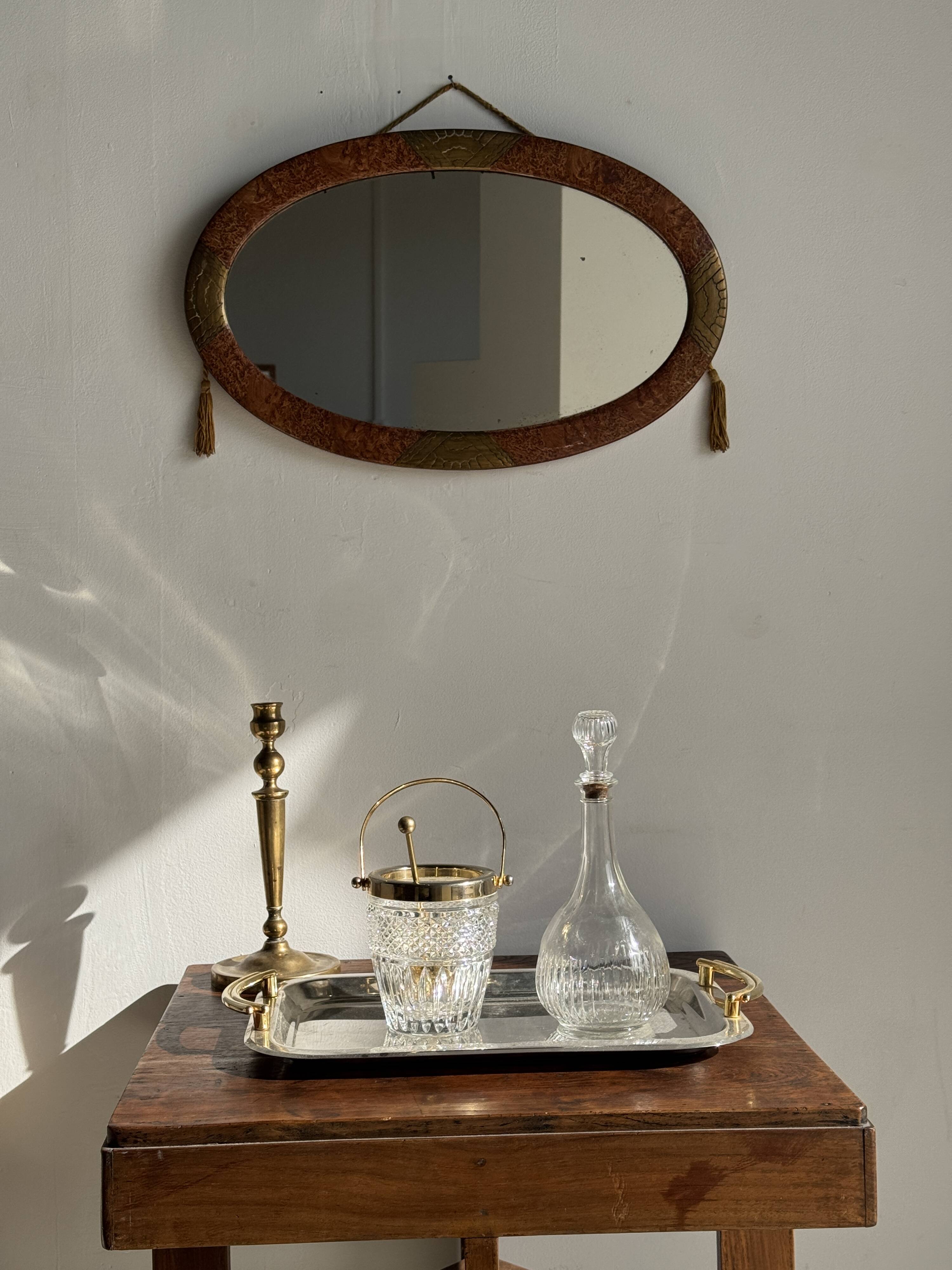 Small oval Art Deco mirror in brown and gold 33x54.