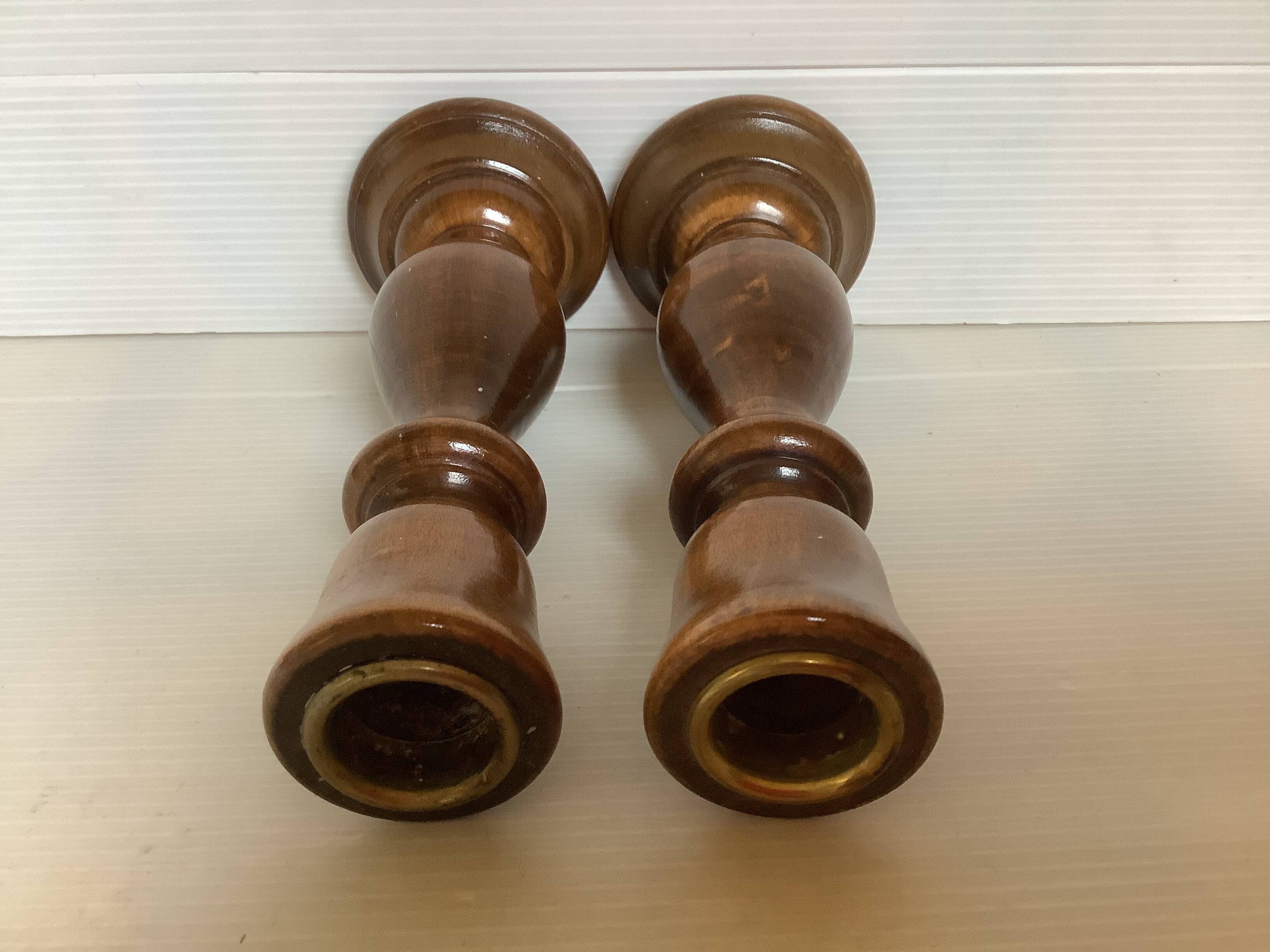 Pair of varnished wooden candlesticks