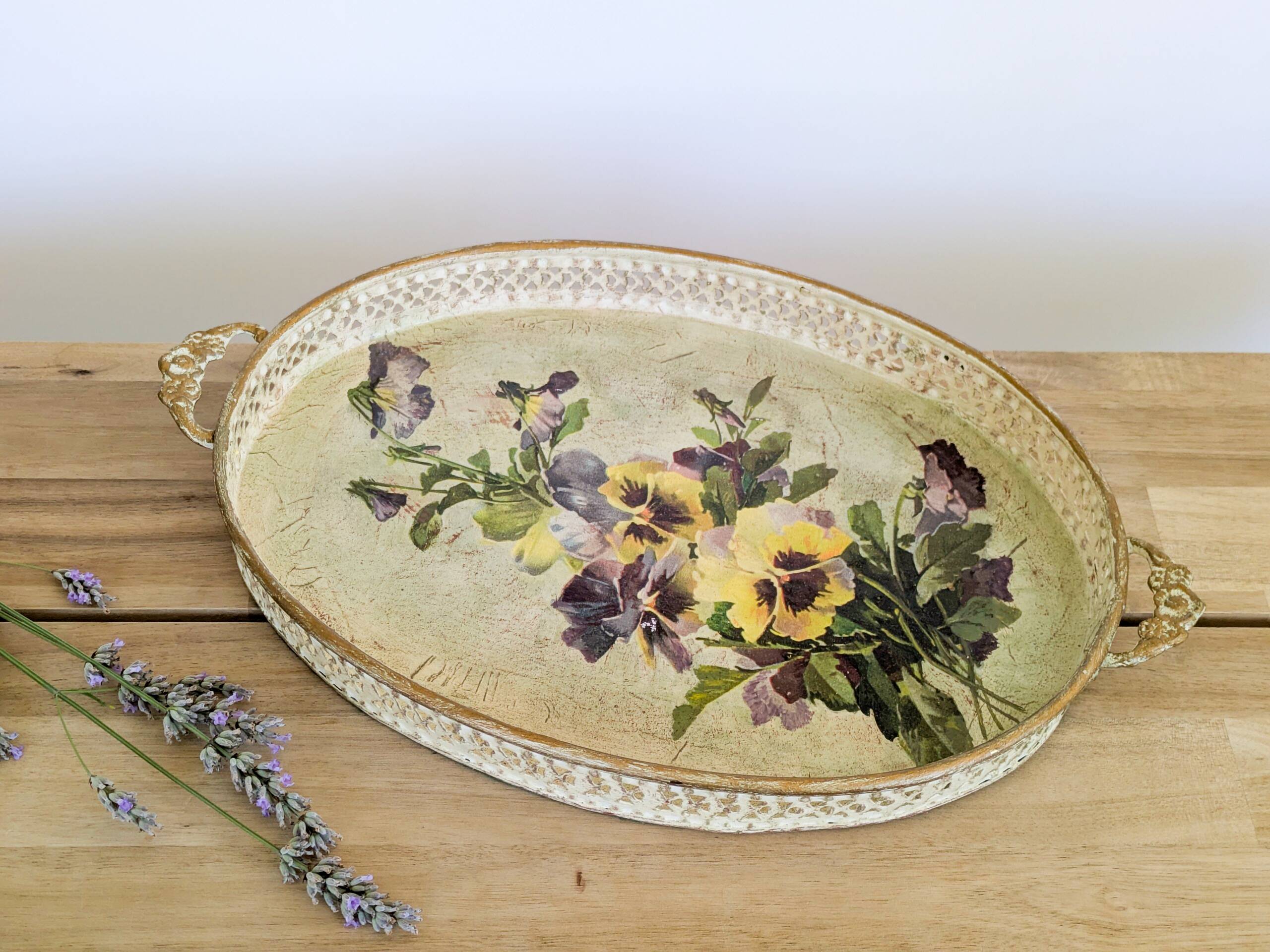 Oval metal decorative vintage tray with floral pattern.