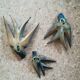 Three old wooden wall swallows