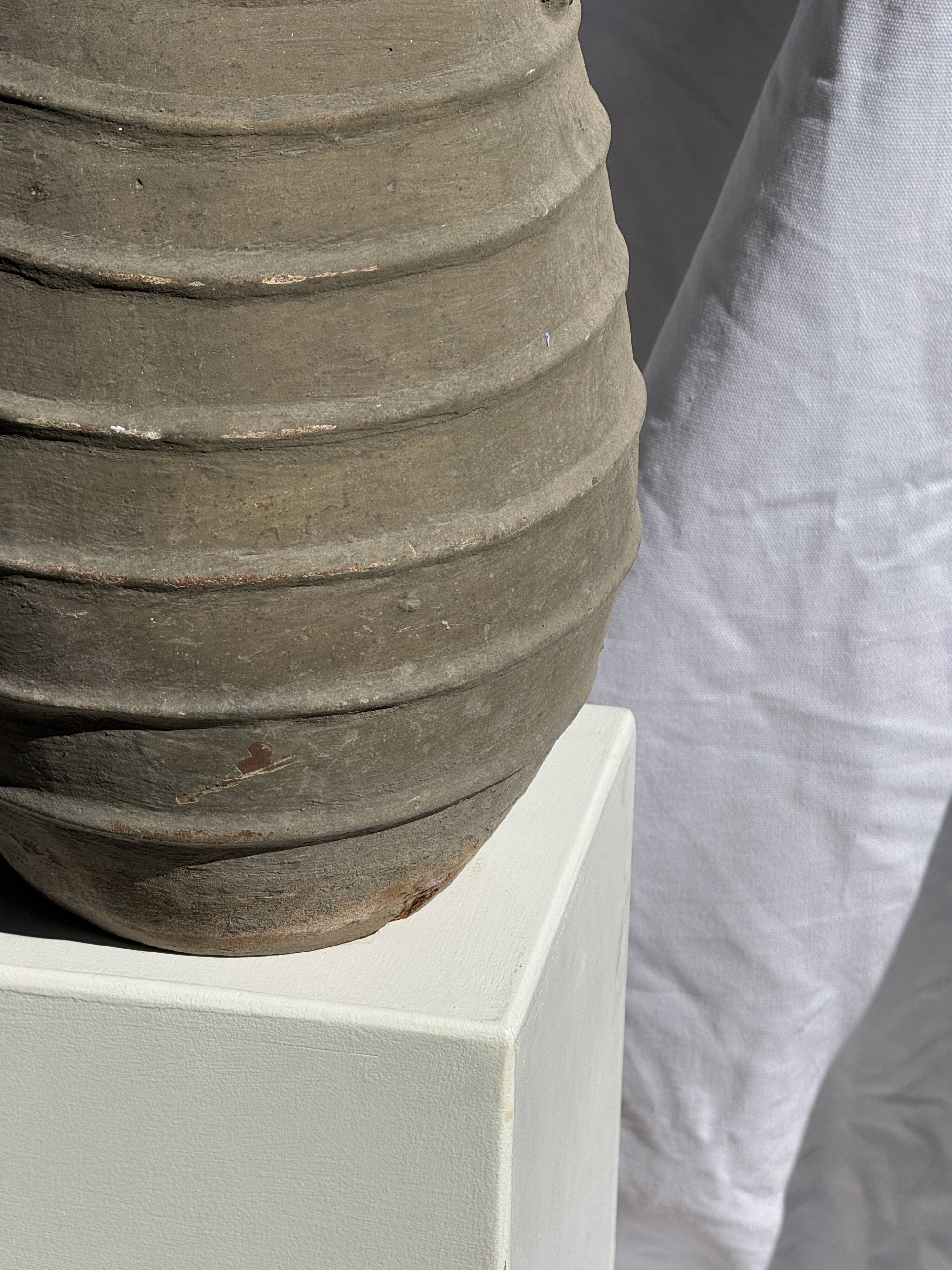 Large oval vase with double handles, featuring raised grey-beige stripes, H42 D28.