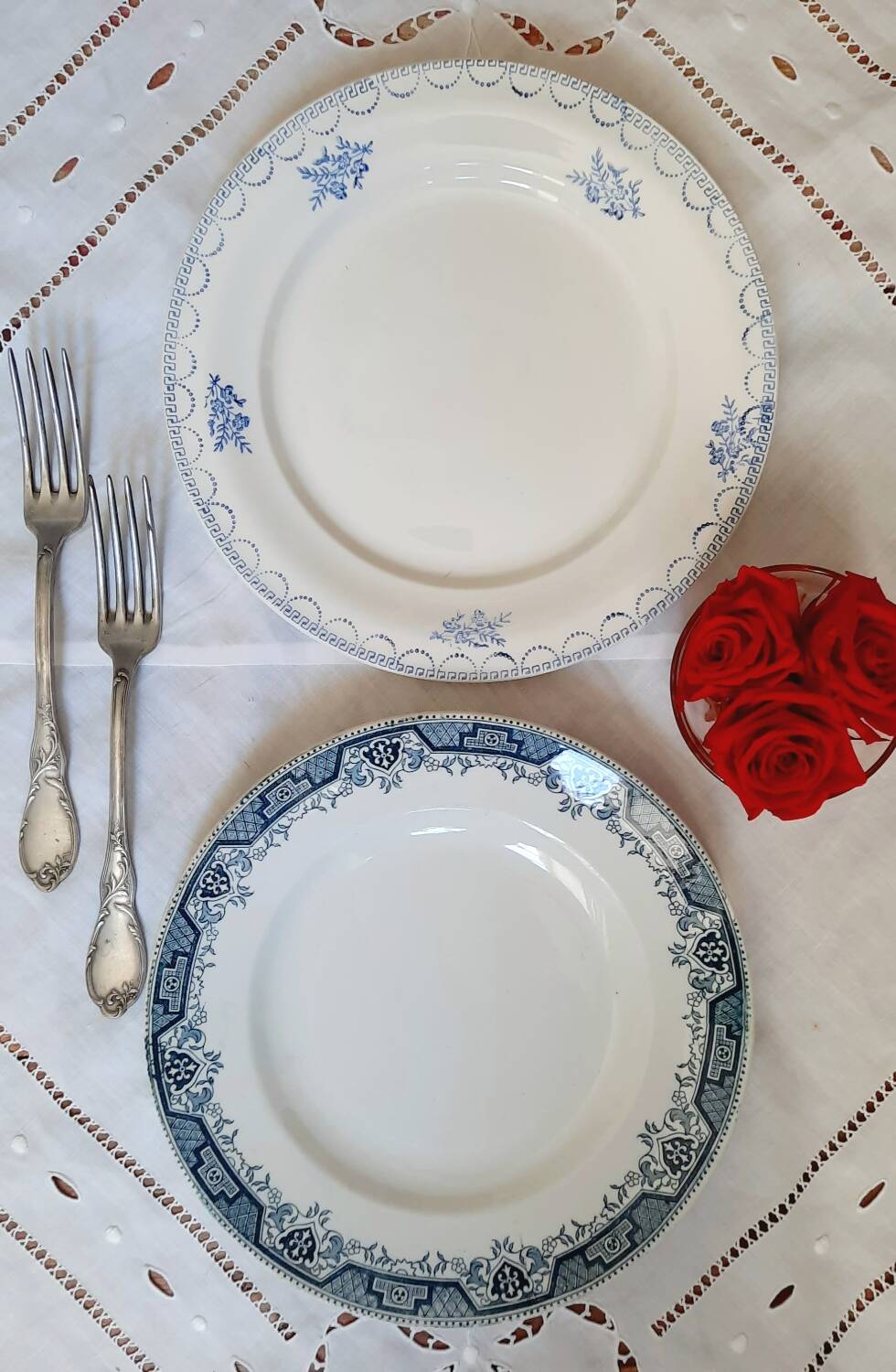 Old mismatched dinner plates accompanied by a dish