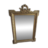 Large antique mirror in wood and gilded stucco.