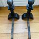 Pair of massive antique-style fire dogs in solid iron from the 20th century.
