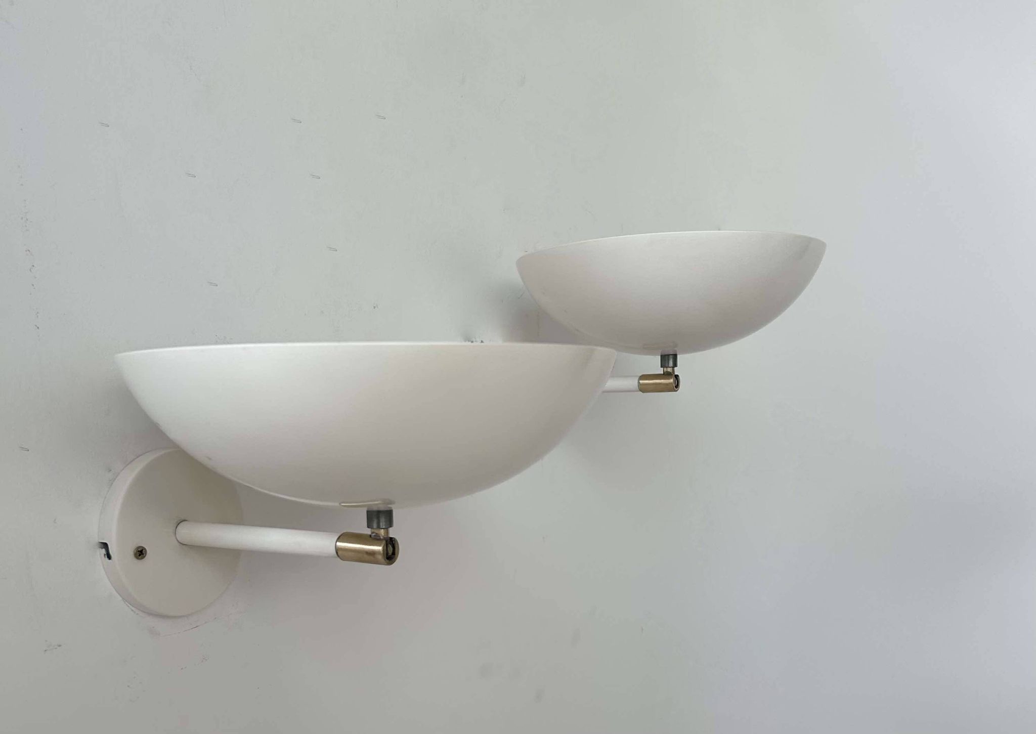 Pair of vintage adjustable wall lights, brass and white metal, France 1970