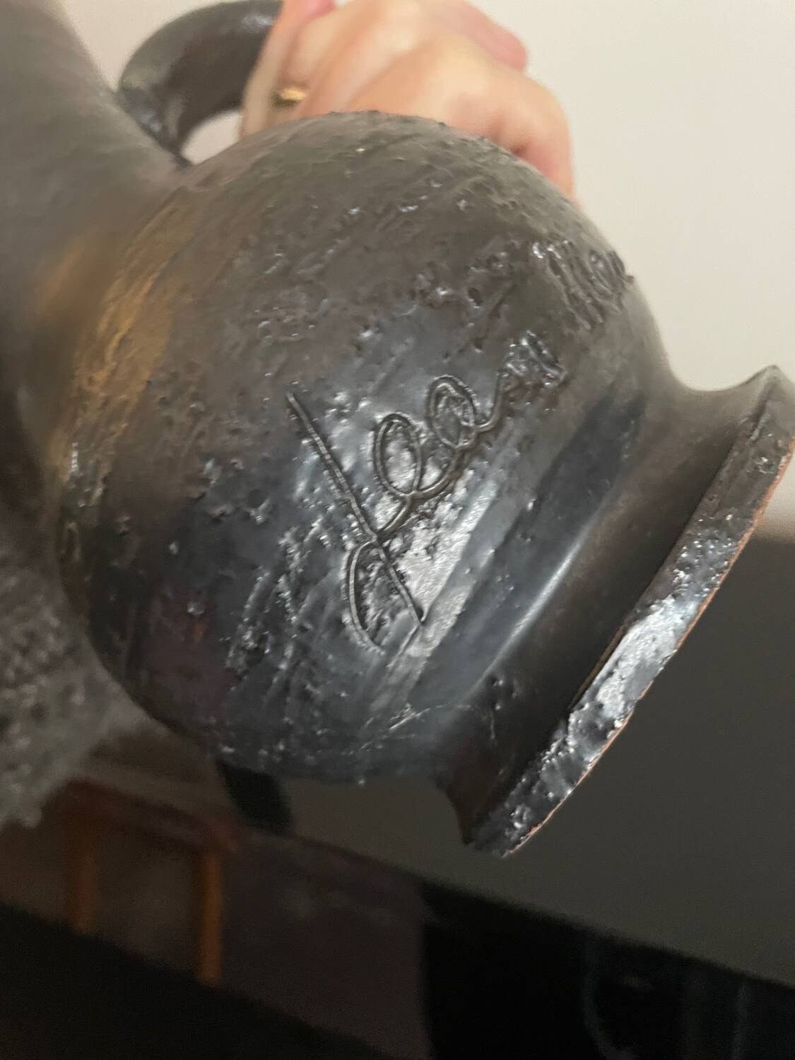 Black ceramic pitcher by Jean Marais