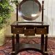 Empire hairdresser from the 19th century in mahogany with a marble top.