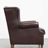 Very beautiful wing chair made of cowhide leather in English style