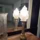 Table lamp with brass base and vintage flame globe