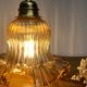 Gold bent wall light vintage tulip in amber glass.