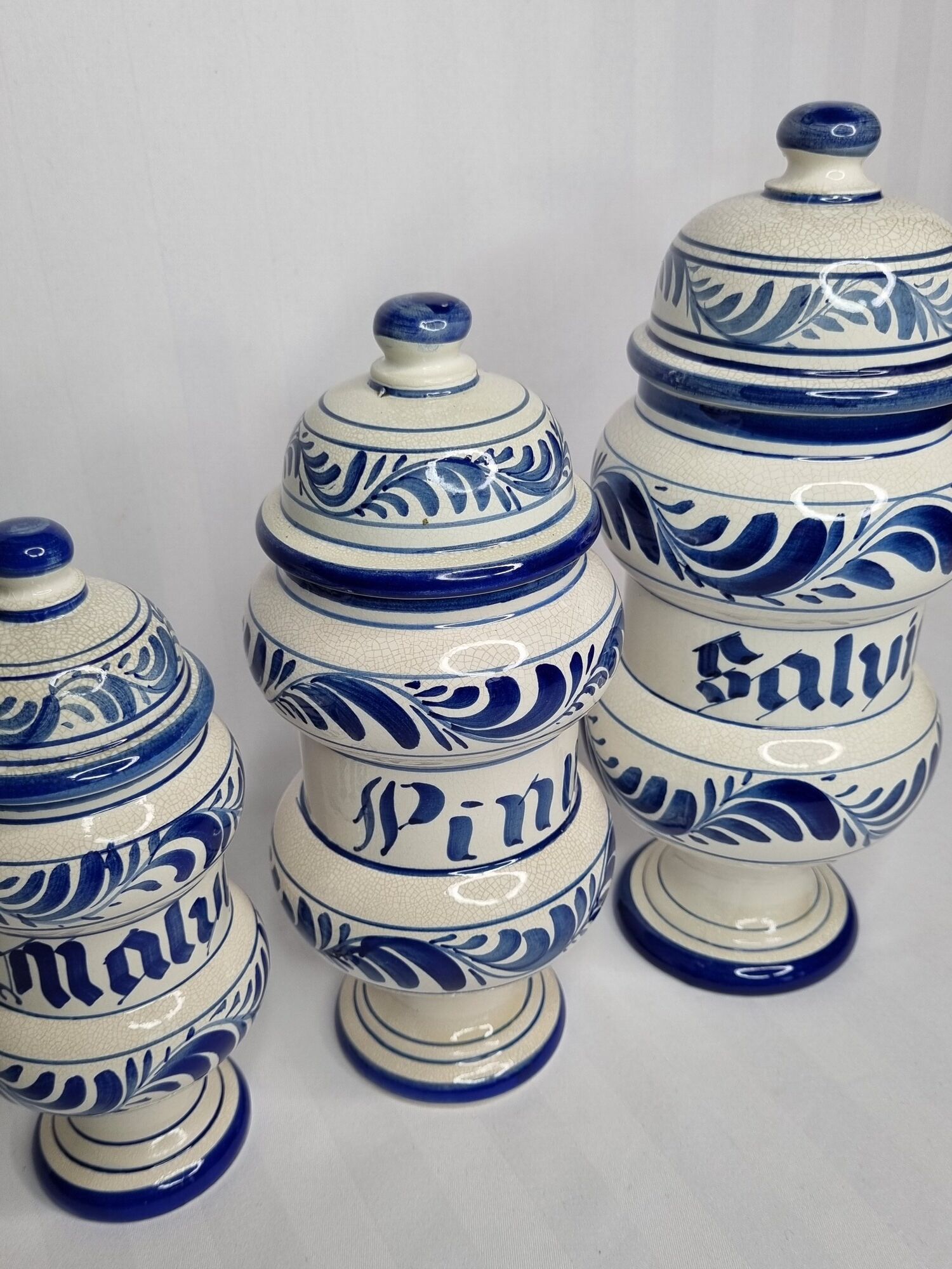 Set of three covered apothecary pots, Malva, Pinus, Salvia in glazed ceramic