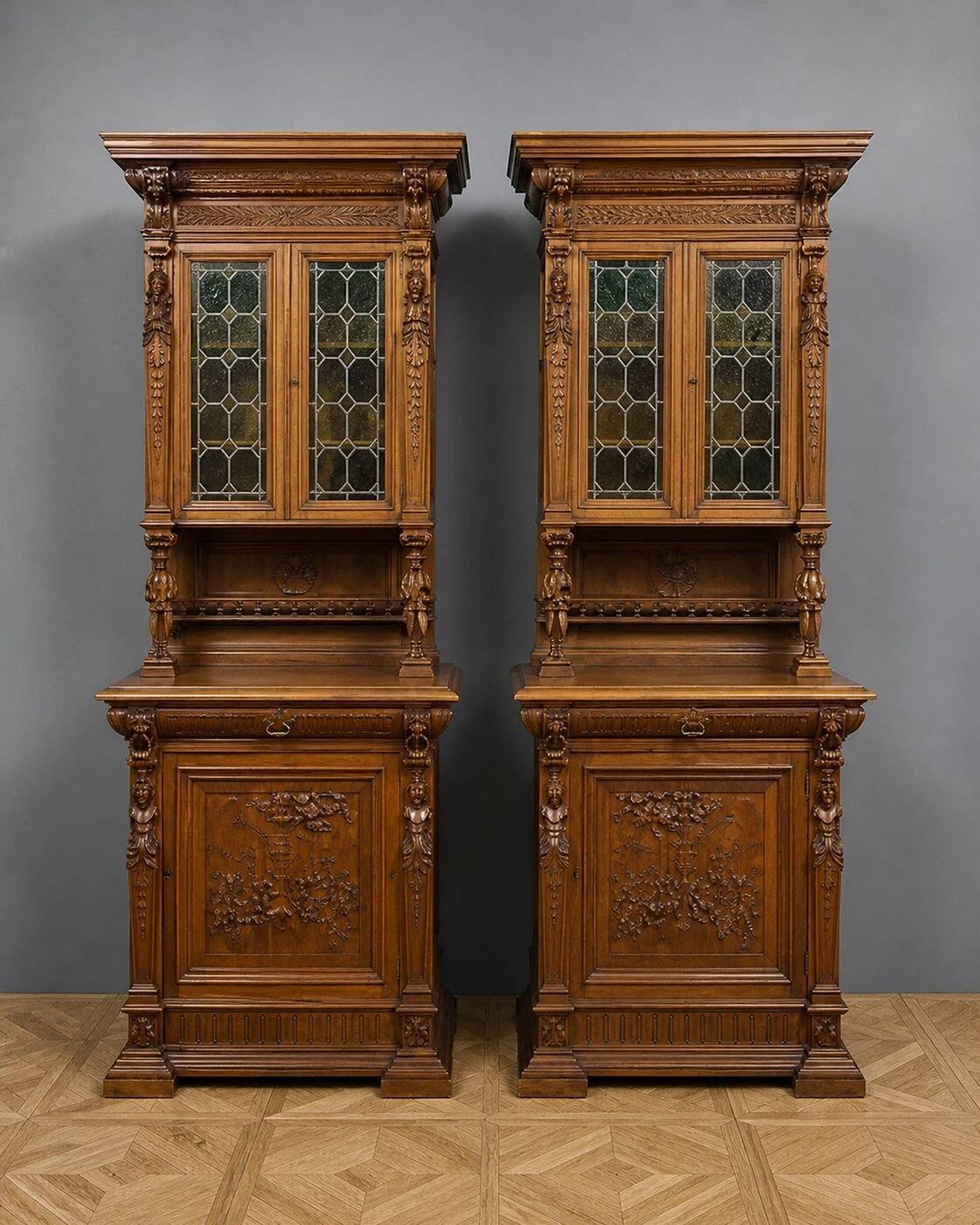 Important pair of two-body buffets in richly carved Renaissance style.