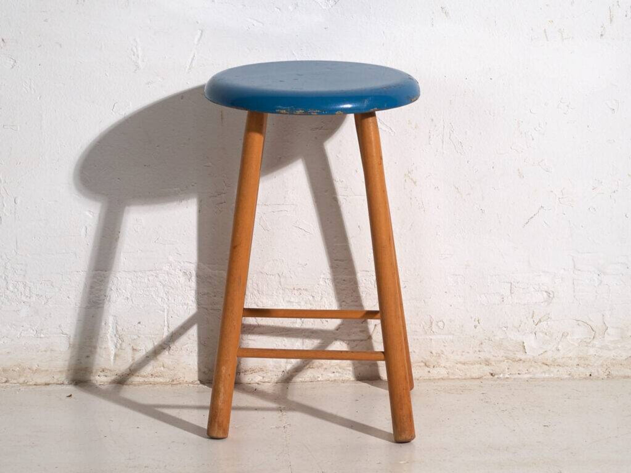 Antique wooden stool with a round seat – Central Europe, around 1950