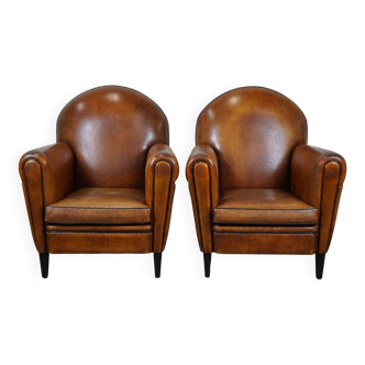 Set of two sheep leather Art Deco style design armchairs with a beautiful patina