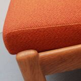 1970s chair in oak and orange cushions