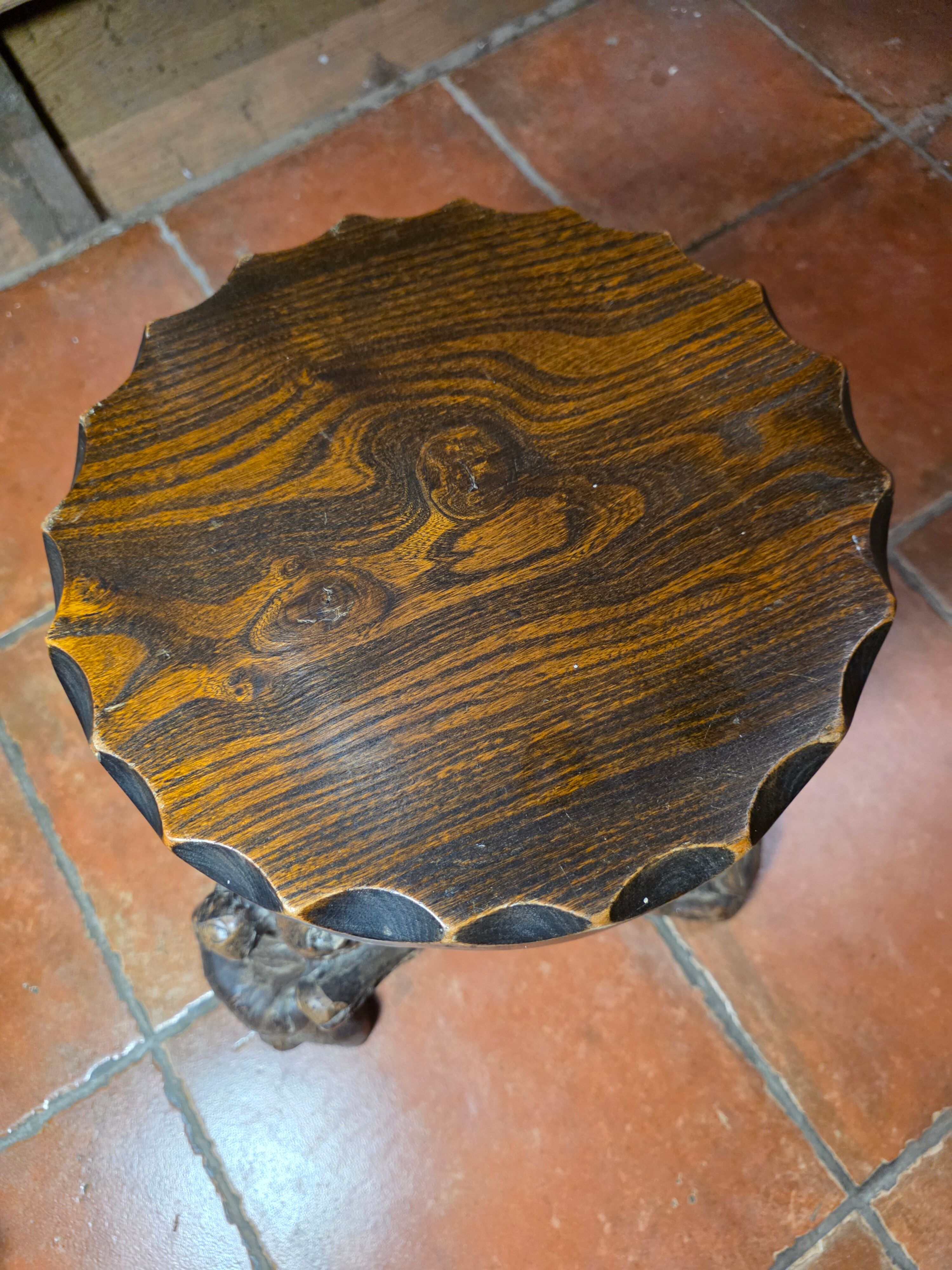 Pair of tripod stools with vine legs, oak top.