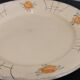 Old Terre de fer earthenware dish, hand painted