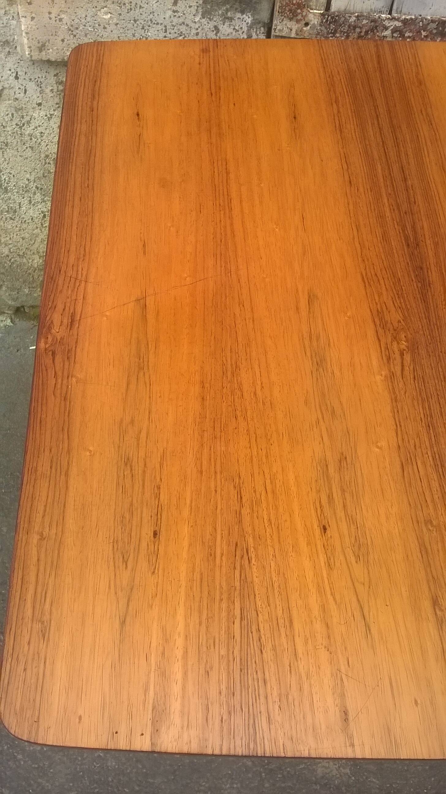 Extendable teak dining table